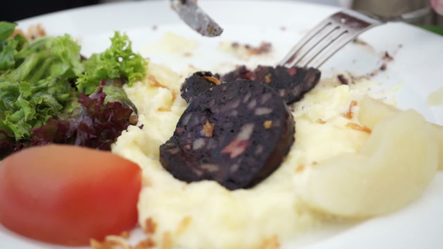 Fried blood sausage with potato