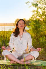 Beautiful young woman doing yoga