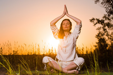 Yoga woman during sunset