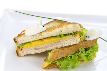 sandwich with ham and cheese, decorated eggs