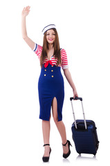 Woman travel attendant with suitcase on white