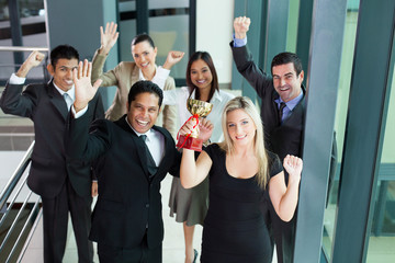 young business people wining a trophy