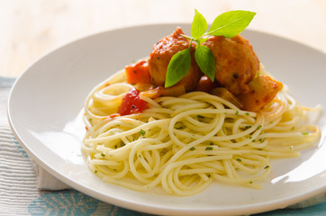 plate of spaghetti with meatballs in tomato marinara sauce and i