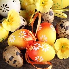 Close-up of quail and Easter eggs.