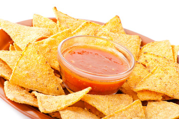 Plate of freshly made spicy nachos with salsa