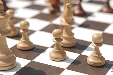 chess pieces on a table in the park
