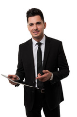 Businessman smiling and pointing at a tablet