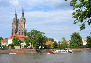 Boats on the river wisla and cathedral in Wroclaw Poland