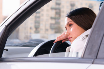 woman is resting in a car