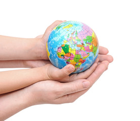 Globe in baby's hands, isolated on a white background