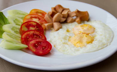 Fried eggs with sausage