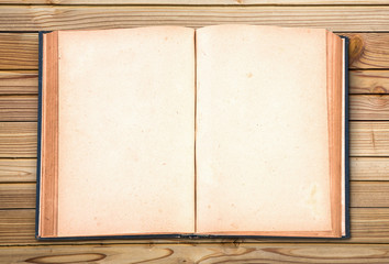 Fototapeta premium Open old vintage book on wooden background