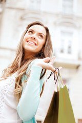 woman with shopping bags in ctiy