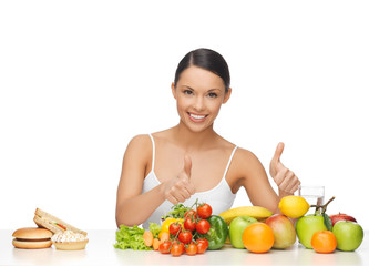 woman with fruits showing thumbs up