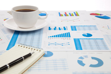 Business report with cup of coffee