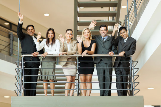 Business People Waving At Stairway