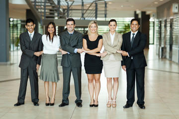 group of business people holding hands