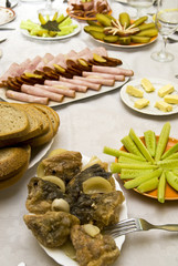 Festively covered table, with various dishes .