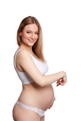 Fototapeta premium Profile portrait of pregnant woman