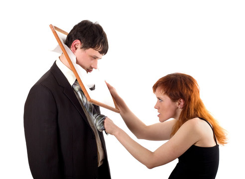 Woman kicking man in head with frame