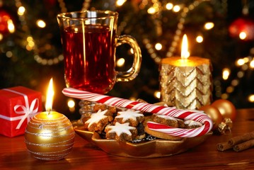 Christmas cookies and candy cane with tea
