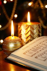 Songbook with Christmas carols and Christmas decorations.