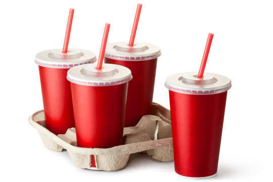 Four red takeout cups with a cup holder