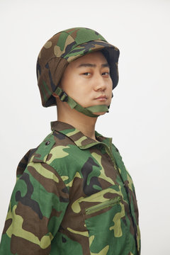 Portrait of man in military uniform, studio shot