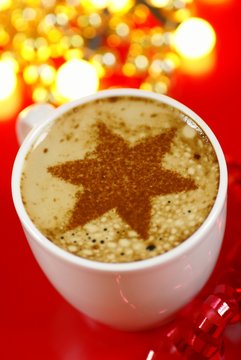 Cup of coffee and cinnamone star.