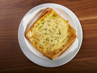 Qutab -baked  lavash cheese pie
