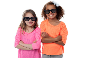 Two little girls in black sunglasses