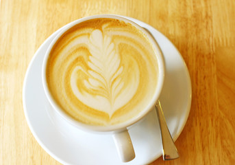 Cup of art latte or cappuccino coffee