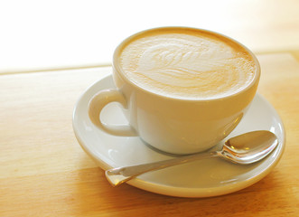 Cup of art latte or cappuccino coffee