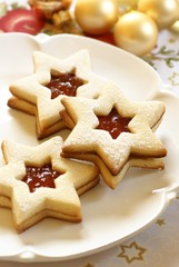 Fototapeta na wymiar Christmas cookies on plate and Christmas ornaments.