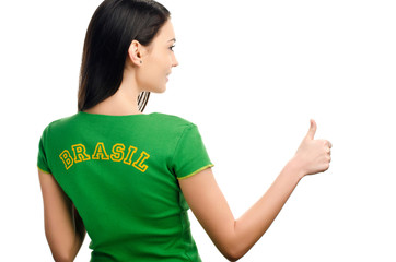 Thumbs up for Brazil.Girl with Brazilian flag on her t-shirt.