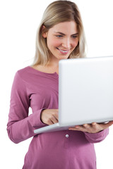 Young woman looking at her laptop