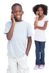 Obraz premium Brother and sister on the phone