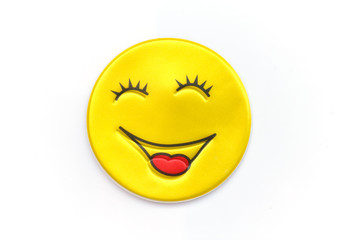 Bright, yellow sticker with a smiley face