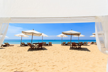 Fototapeta premium beds and umbrella on a beach