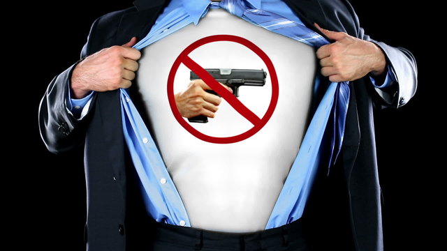 superhero against guns - tears open shirt revealing image of anti-gun symbol