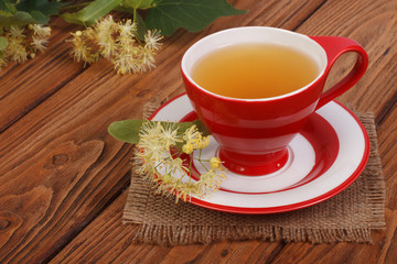 Herbal tea with a linden on a napkin in a rustic style
