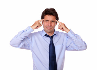 Attractive man with headache holding his forehead