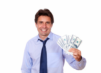 Attractive business man holding up cash dollars