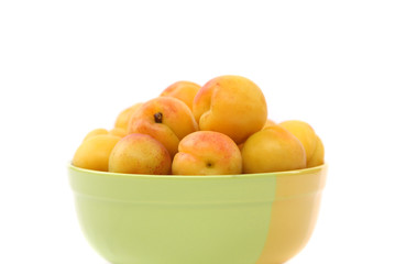 Naklejka na ściany i meble fresh apricots in the bowl on a white background