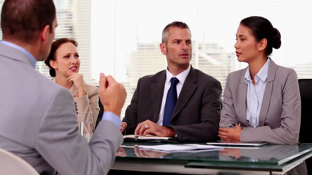 Business people listening to a job applicant