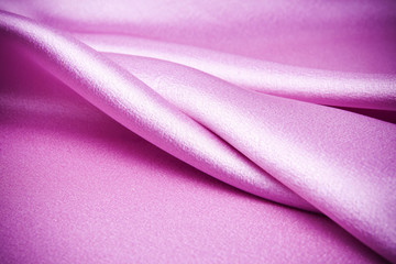 Pink satin fabric, it waves.
