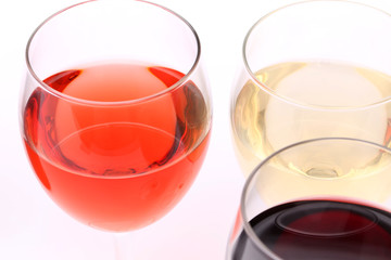 three glasses with white, rose and red wine