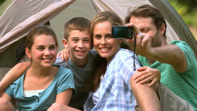 Happy family taking a photo of themselves