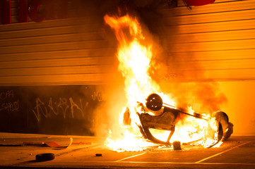 Car catching fire, after act of vandalism in the street