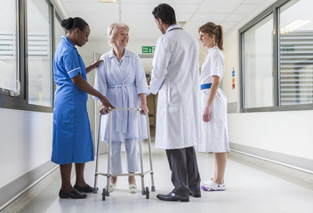 Senior Female Hospital Patient in Walking Frame Doctor Nurse